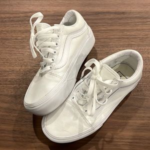 All white Vans, size 5.5 women’s